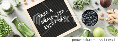 Take a small step every day letter board quote flat lay Take a small step every day letter board quote flat lay 99144651