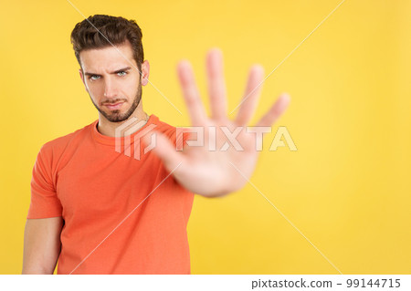 Caucasian man gesturing prohibition with hand Caucasian man gesturing prohibition with hand 99144715