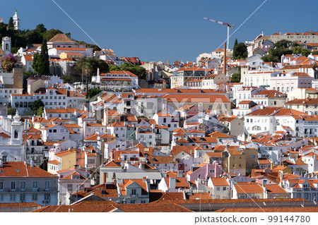 Lisbon, Portugal skyline of orange rooftops on the Tagus River. Vacation and travel concept Lisbon, Portugal skyline of orange rooftops on the Tagus River. Vacation and travel concept 99144780