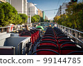 View from open roof of red, turistic hop on bus with tourists inside. Vacation, travel concept 99144785