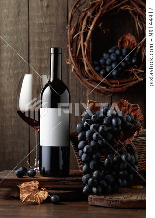 Bottle of red wine with empty label. Bottle of red wine with empty label. 99144912