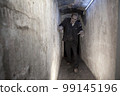 Zombie in a tunnel 99145196