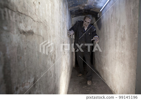 Zombie in a tunnel 99145196