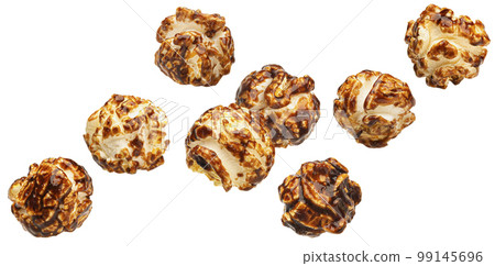 Falling caramel popcorn isolated on white background 99145696