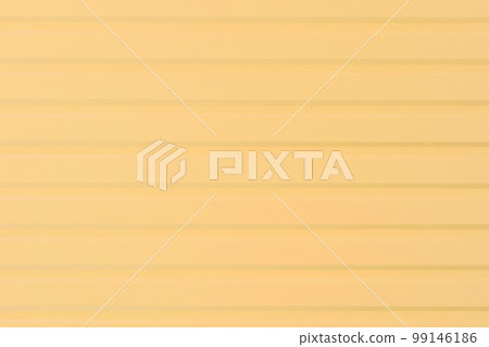 Light yellow metal fence warm cream color surface texture wall abstract background 99146186