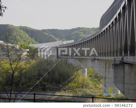Tama river and modern bridge. Ken-O Expressway Tamagawa Bridge. Tama river and modern bridge. Ken-O Expressway Tamagawa Bridge. 99146272