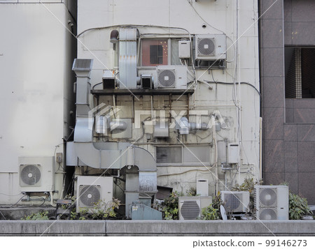 The wall of a multi-tenant building. Complex building equipment. The wall of a multi-tenant building. Complex building equipment. 99146273