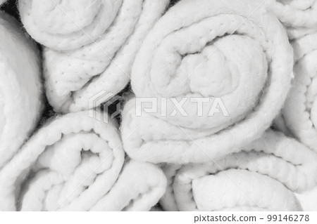 Set of soft white knitted light woolen fabric cotton bright blankets vintage background, close-up Set of soft white knitted light woolen fabric cotton bright blankets vintage background, close-up 99146278