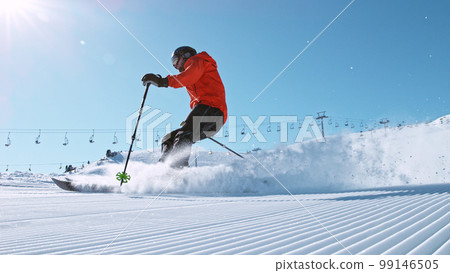 Alpine skier running down the hill. Alpine skier running down the hill. 99146505
