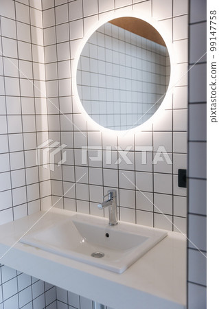 Sink and mirror in the bathroom. Element of interirior 99147758