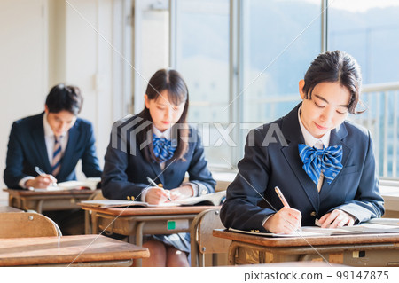 High school students wearing uniforms studying in the classroom 99147875