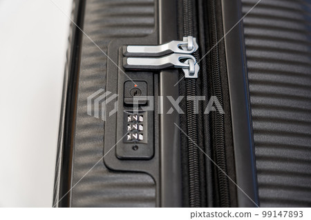 Vertical close-up view of a digital lock and zipper on a suitcase Vertical close-up view of a digital lock and zipper on a suitcase 99147893