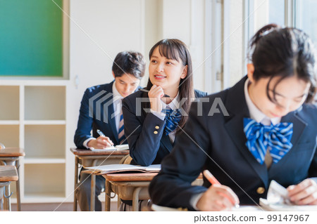 High school students wearing uniforms studying in the classroom 99147967