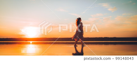 Portrait happy laughing woman in pink dress Portrait happy laughing woman in pink dress 99148043