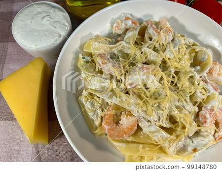 Pasta with shrimps and blue cheese sauce Pasta with shrimps and blue cheese sauce 99148780