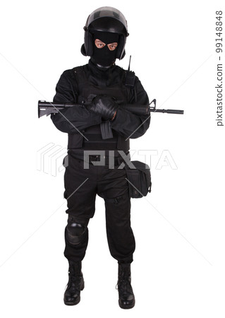 Riot police officer in black uniform with assaut rifle Riot police officer in black uniform with assaut rifle 99148848