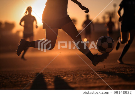 silhouettes of people playing soccer 99148922