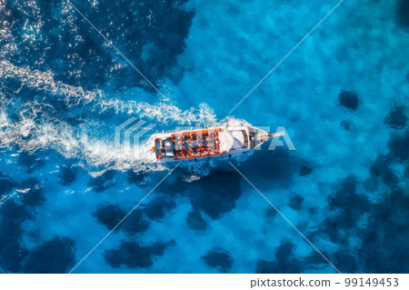 Aerial view of beautiful floating yacht in blue sea at sunny day 99149453