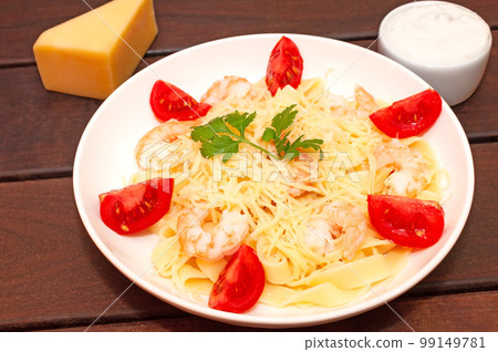 Pasta with shrimps, tomatoes and parmesan cheese Pasta with shrimps, tomatoes and parmesan cheese 99149781