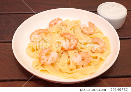 Pasta with shrimps and blue cheese sauce Pasta with shrimps and blue cheese sauce 99149782