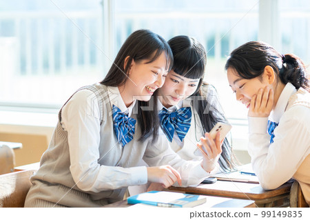 High school girl smartphone classroom High school girl smartphone classroom 99149835