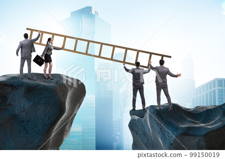 Business people helping to go over chasm 99150019