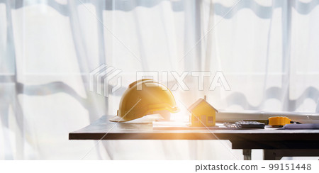 Architecture or Civil engineer analyze with construction blueprint. plan, engineer sketching a construction project, green energy concept 99151448