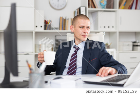 Young businessman working on laptop Young businessman working on laptop 99152159