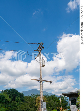 The electric pole and electric transformer with blue sky cloud. The electric pole and electric transformer with blue sky cloud. 99154512