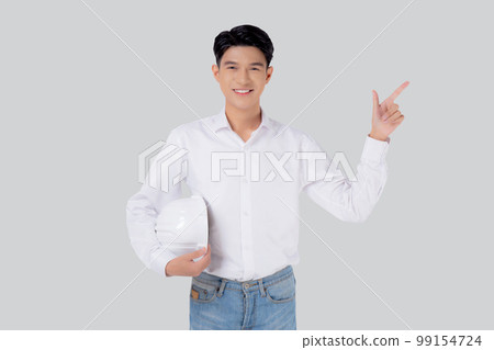 Portrait young asian man is engineer holding helmet standing and smiling with confident isolated. 99154724