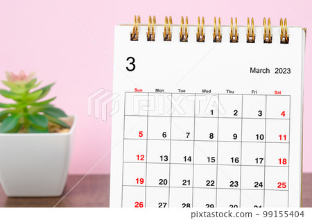 Close up the March 2023 Monthly desk calendar on wooden table. Close up the March 2023 Monthly desk calendar on wooden table. 99155404