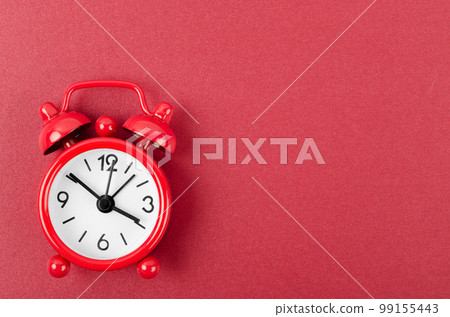 The Red alarm clock on red colour background. The Red alarm clock on red colour background. 99155443