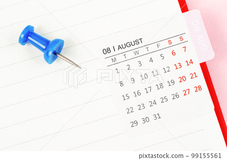 The Mini August calendar on a white note book with push pin on pink colour background. The Mini August calendar on a white note book with push pin on pink colour background. 99155561