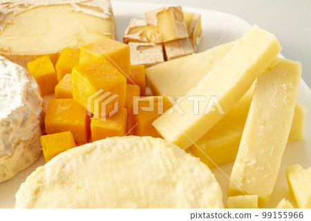 Assortment of fresh and delicious cheeses 99155966