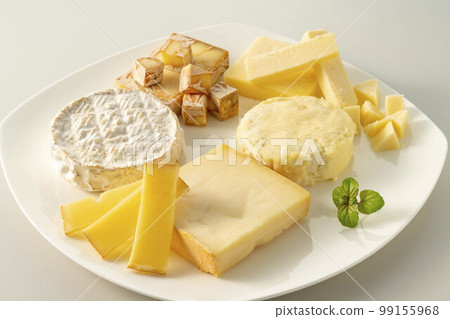 Assortment of fresh and delicious cheeses 99155968