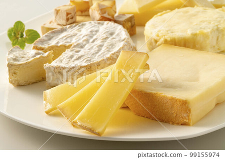Assortment of fresh and delicious cheeses Assortment of fresh and delicious cheeses 99155974