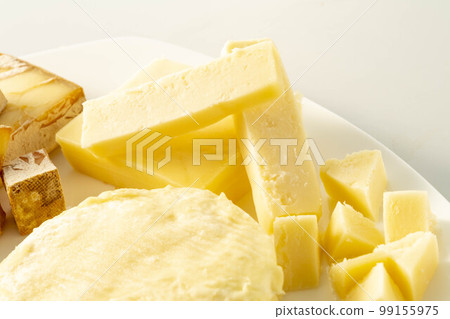 Assortment of fresh and delicious cheeses Assortment of fresh and delicious cheeses 99155975
