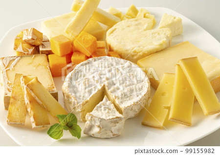 Assortment of fresh and delicious cheeses - Stock Photo [99155982