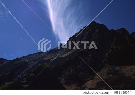 clouds rising from mountains 99156044