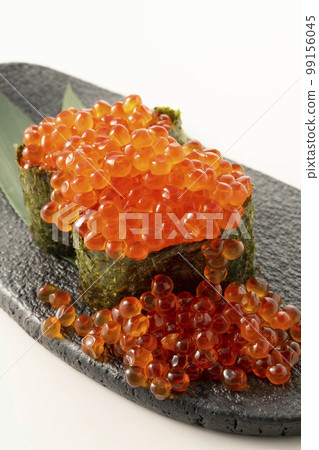 Gunkanmaki with fresh salmon roe and salmon roe Gunkanmaki with fresh salmon roe and salmon roe 99156045