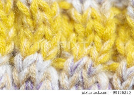 Background of the wool yarn. Woolen fabric texture closeup. Textile texture background. Detailed warm yarn background. Background of the wool yarn. Woolen fabric texture closeup. Textile texture background. Detailed warm yarn background. 99156250