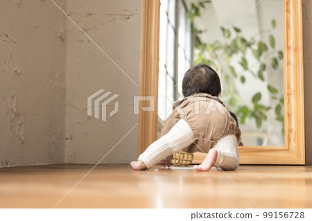 A baby crawling from behind A baby crawling from behind 99156728