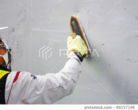 Concrete retaining wall spalling prevention work (finishing status with a trowel) Concrete retaining wall spalling prevention work (finishing status with a trowel) 99157199