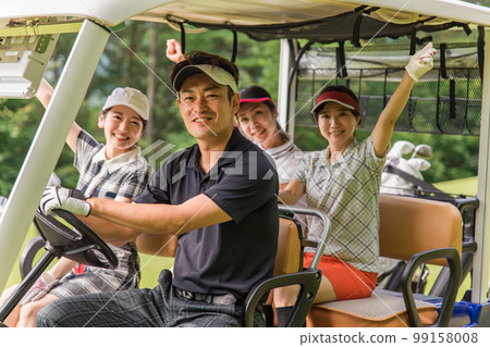 Golfer man and woman riding a golf cart on a golf course Golfer man and woman riding a golf cart on a golf course 99158008