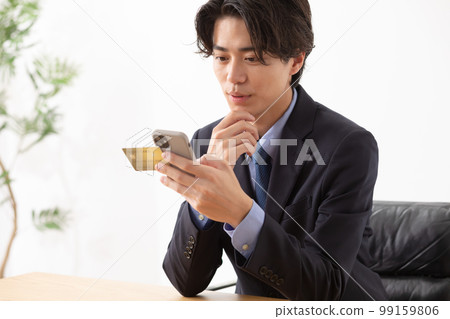 Businessman credit card smartphone 99159806