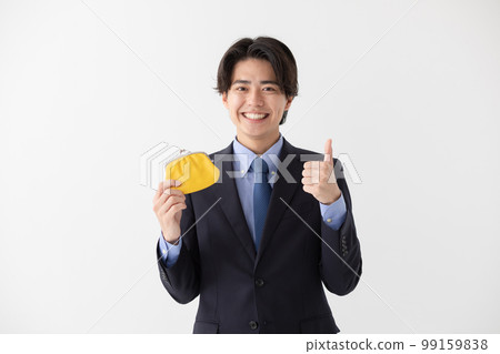 Businessman wallet clasp thumbs up Businessman wallet clasp thumbs up 99159838