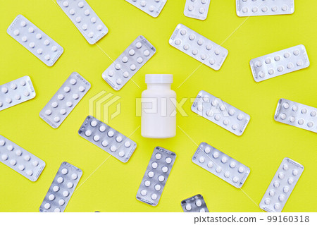 AGA drug pills on green background 99160318
