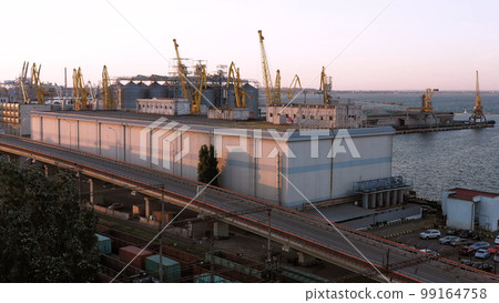 Tower cranes on the Odesa sea port. Evening urban cityscape. Tower cranes on the Odesa sea port. Evening urban cityscape. 99164758