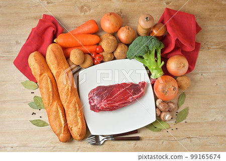 Image of beef stew ingredients, beef shank, vegetables, herbs, spices, carrots, onions. Image of beef stew ingredients, beef shank, vegetables, herbs, spices, carrots, onions. 99165674
