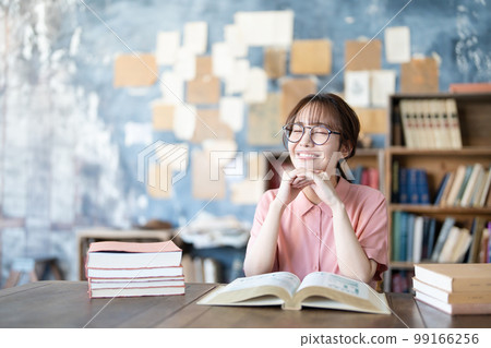 A young woman reading A young woman reading 99166256
